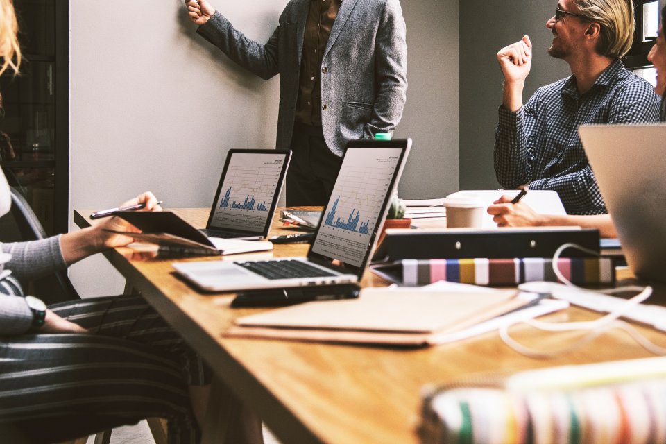 People in a board room holding a business meeting.